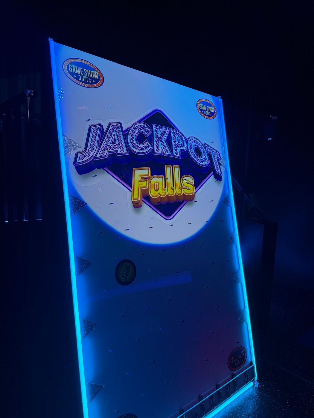 Giant lit Plinko board, Jackpot Falls